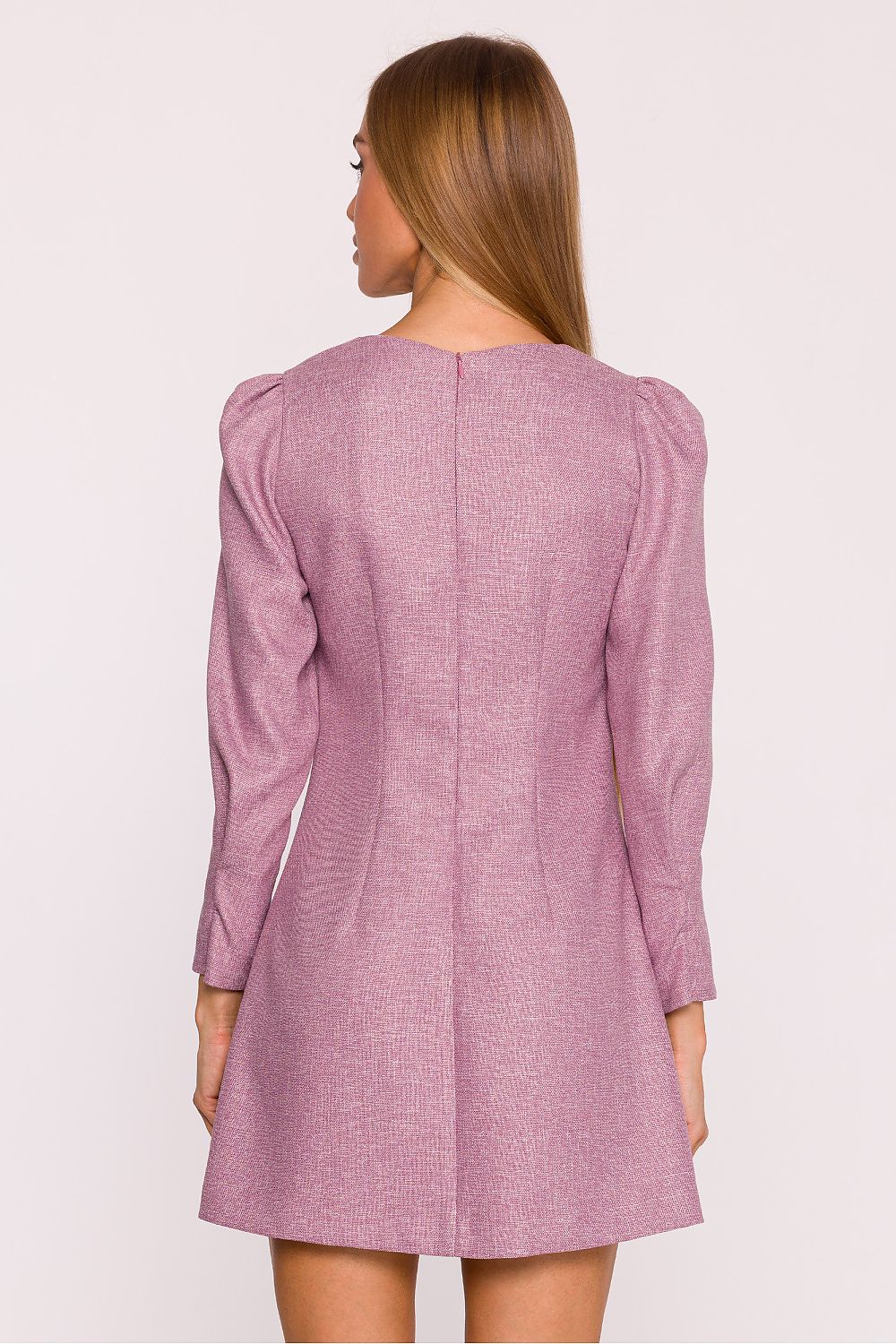 Stylish model wearing Moe's elegant tweed daydress with embellished pockets, exemplifying modern feminine elegance.