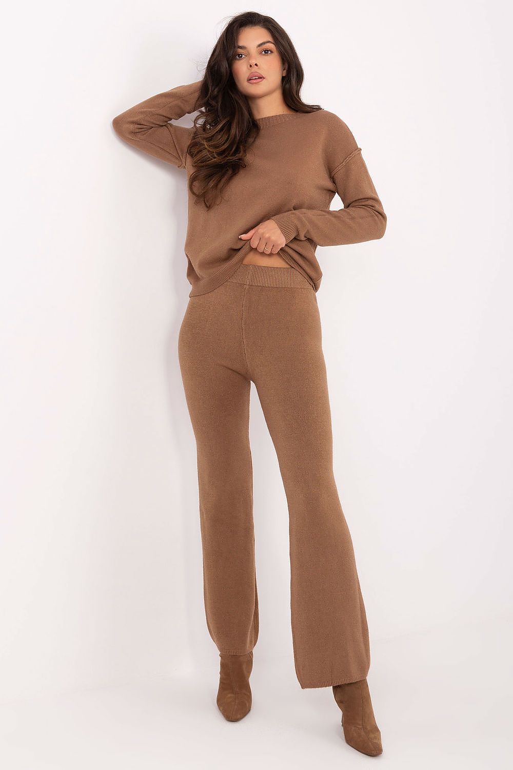 Luxurious Italy Moda casual sweater set featuring a soft viscose blend, complete with a stylish round neck sweater and wide leg pants, designed for comfort and elegance.