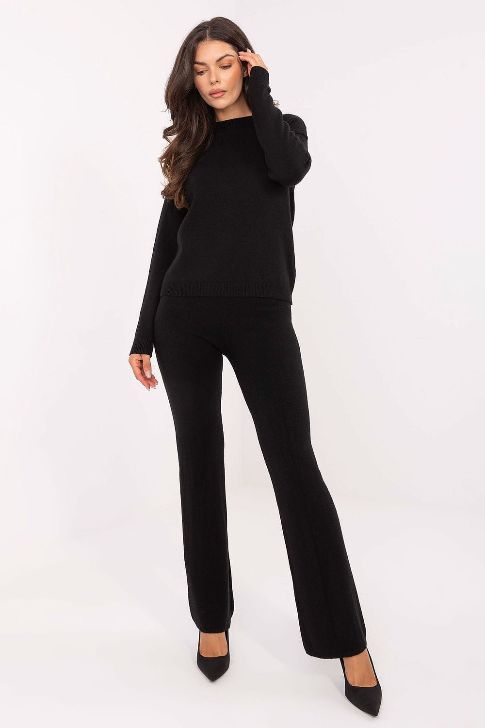 Close-up of the Italy Moda sweater and wide leg pants set, showcasing the elegant round neckline and modern high waisted design.