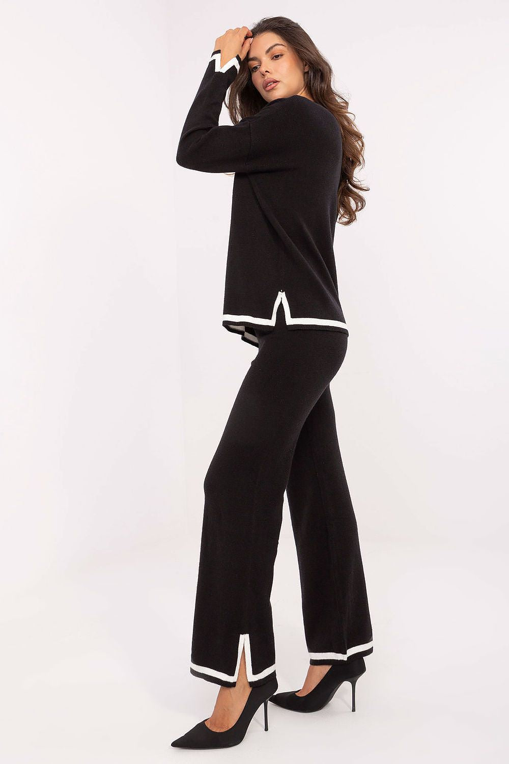 Elegant Italy Moda women's V-neck sweater set showcasing a soft sweater and high-waisted pants, perfect for modern comfort and style.