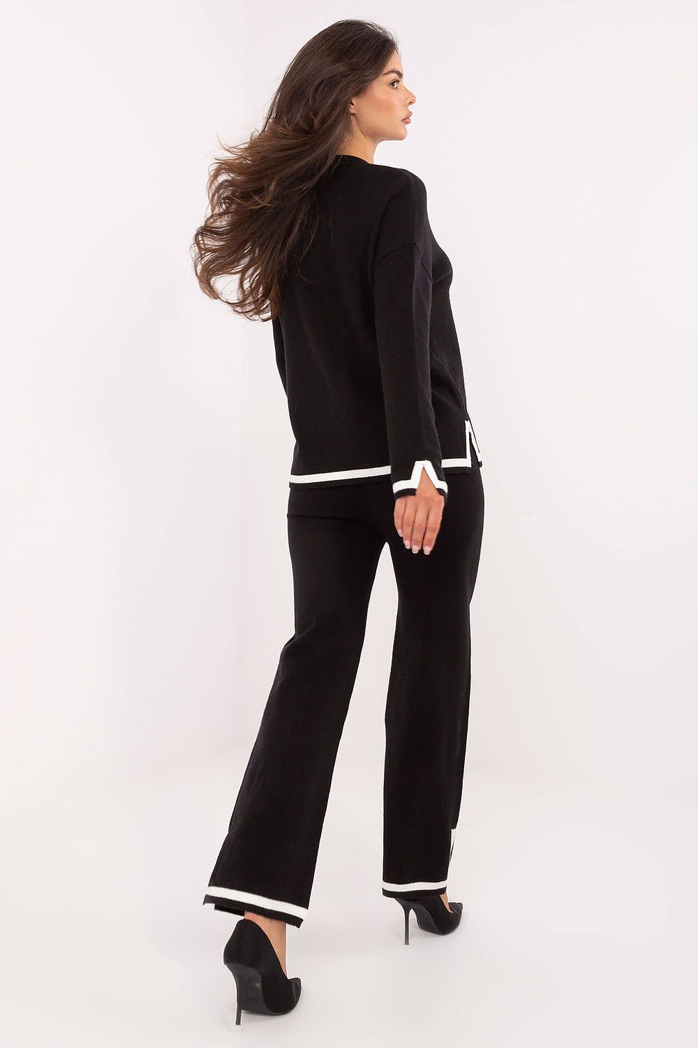 Close-up of Italy Moda women's V-neck sweater set highlighting the luxurious fabric and trendy design details with slits.