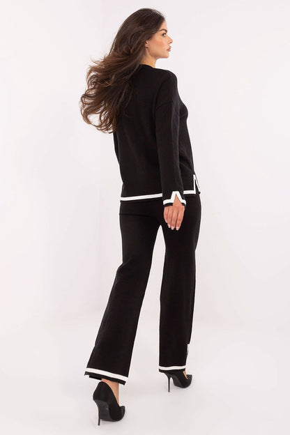 Close-up of Italy Moda women's V-neck sweater set highlighting the luxurious fabric and trendy design details with slits.
