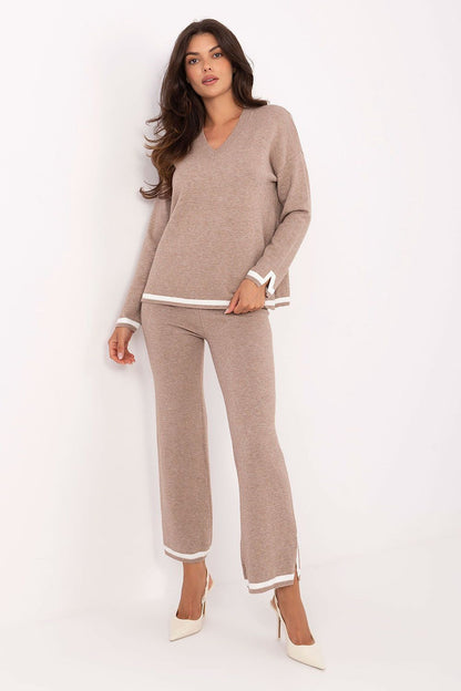 Italy Moda Women's luxurious V-neck sweater set with high-waisted pants, showcasing modern comfort and elegant style.