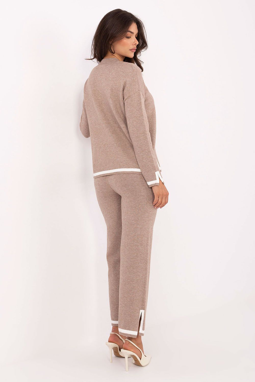 Italy Moda Women's sweater set, featuring a stylish V-neck and high-waisted trousers, exemplifying contemporary fashion and elegance.