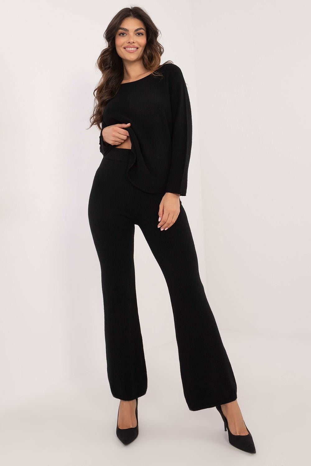 Luxury women's sweater set by Italy Moda featuring a high-quality sweater and high-waisted wide-leg pants, designed for comfort and style in EU size 0, crafted from a soft blend of viscose, polyester, and nylon.