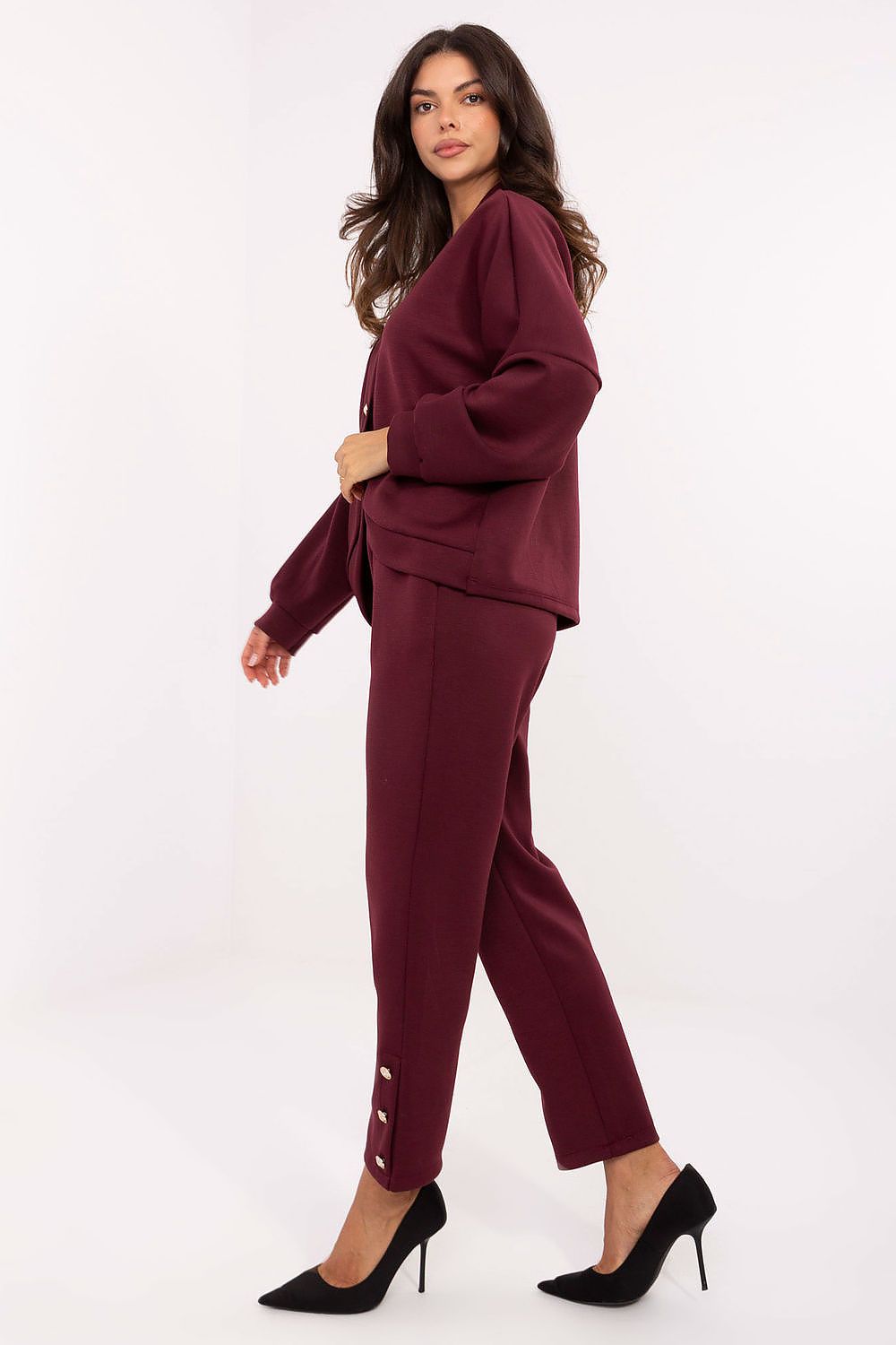 Elegant women's casual viscose set by Rue Paris in soft butter-like fabric, featuring high-waisted trousers and a stylish V-neck blouse.