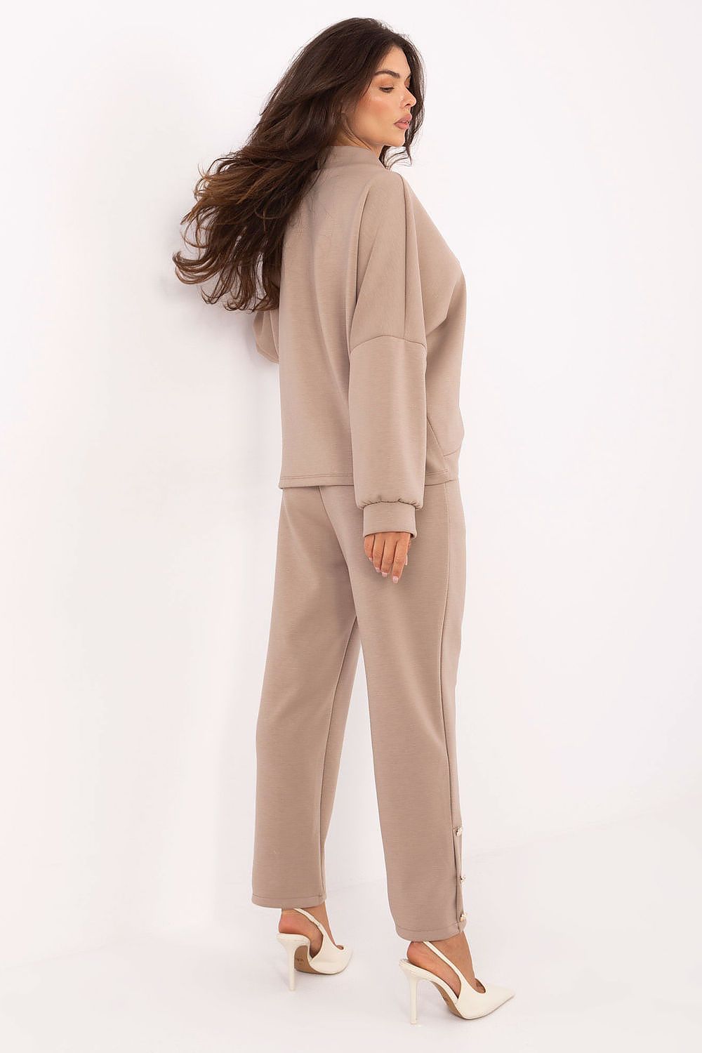 Stylish high-waisted trousers from Rue Paris's elegant women's viscose set, designed with a comfortable elastic waistband and decorative buttons.