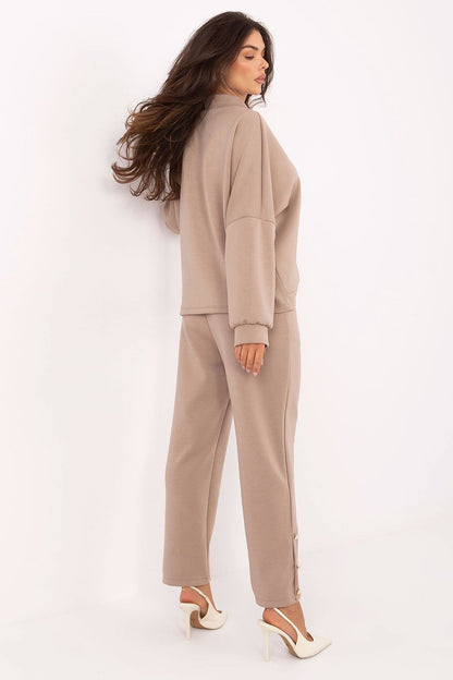 Stylish high-waisted trousers from Rue Paris's elegant women's viscose set, designed with a comfortable elastic waistband and decorative buttons.