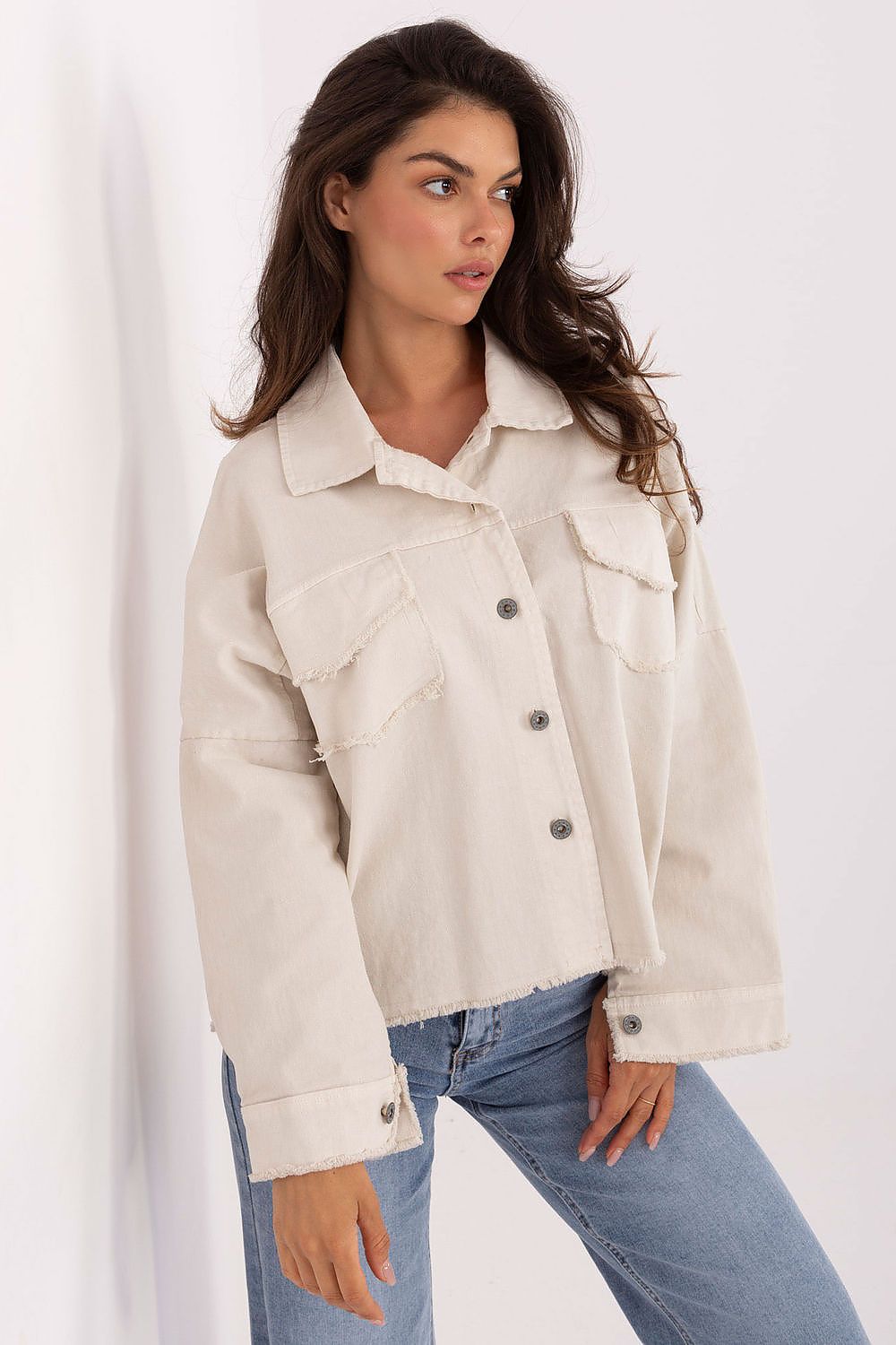 Close-up of the classic buttoned design and flapped chest pockets of the Timeless Long Sleeve Denim Shirt for Women by Rue Paris, highlighting its sophisticated detailing.