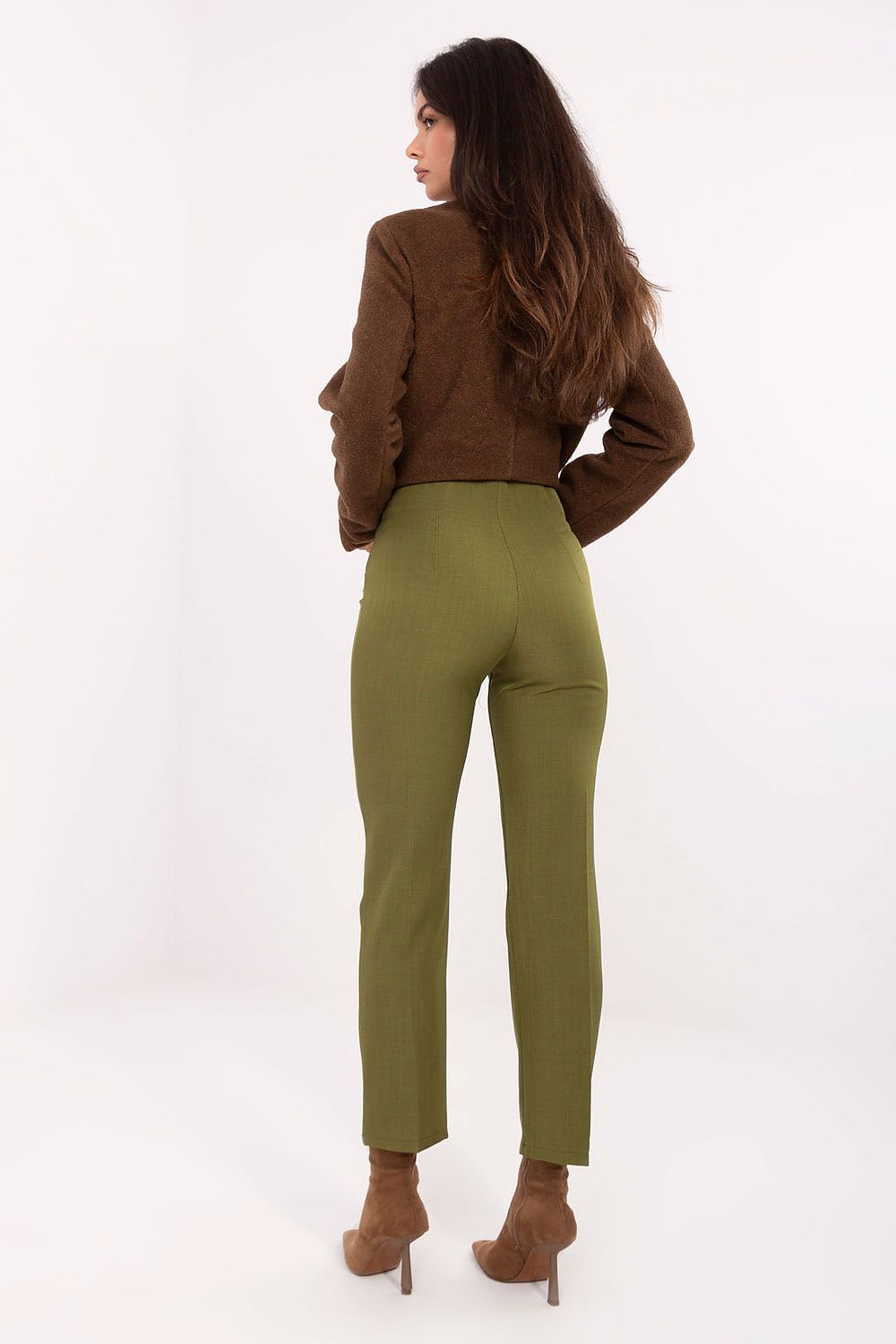 Model wearing elegant high-waisted cigarette trousers from Rue Paris, perfectly accentuating the waist and tapered legs.