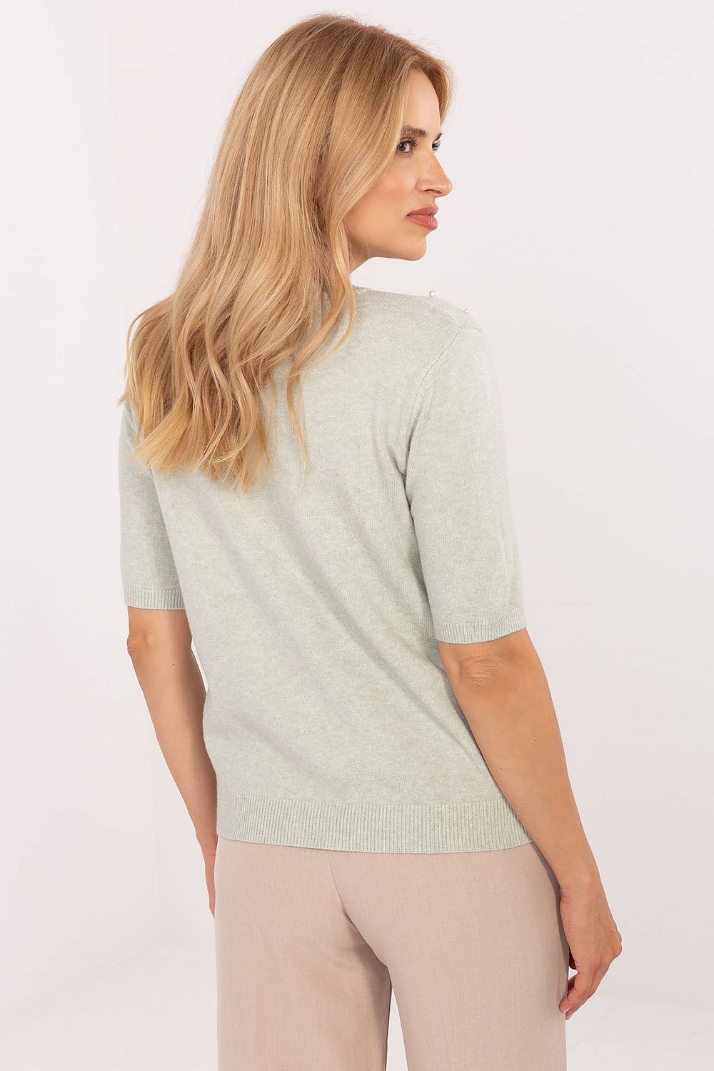 Elegant women's short sleeve sweater adorned with decorative pearls, made by Factory Price, showcasing luxurious soft viscose blend fabric.