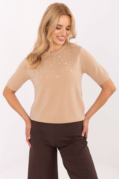 Close-up of the exquisite pearl detailing on the women's sweater, highlighting elegance and sophistication, available from Factory Price.