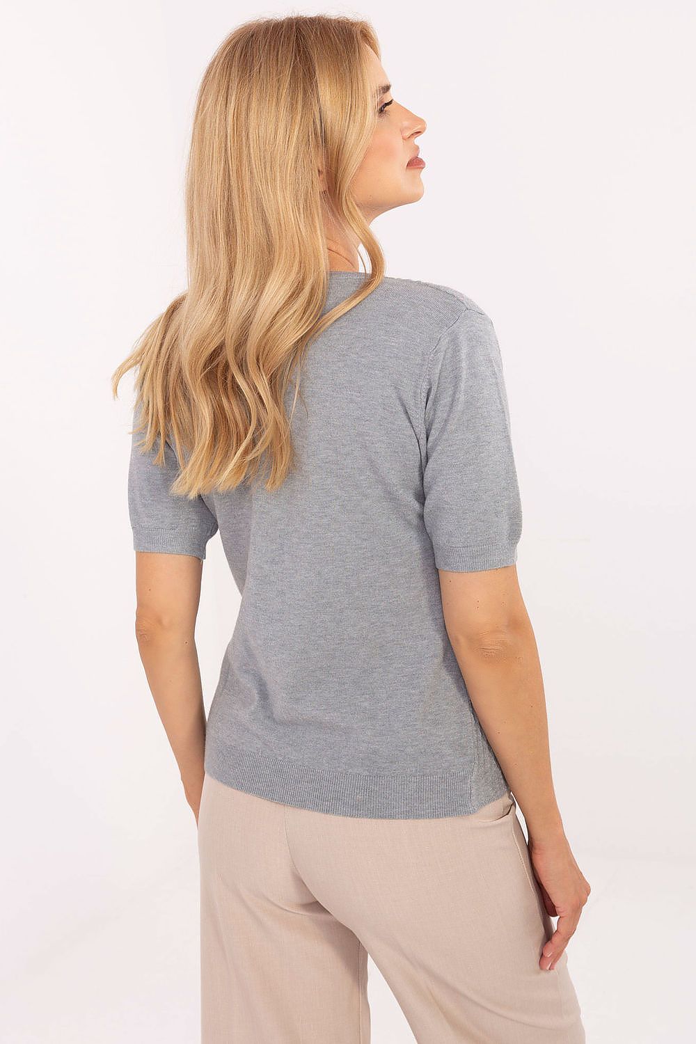 Stylish women's sweater from Factory Price showcased in standard length with short sleeves, perfect for creating fashionable looks with skirts or trousers.