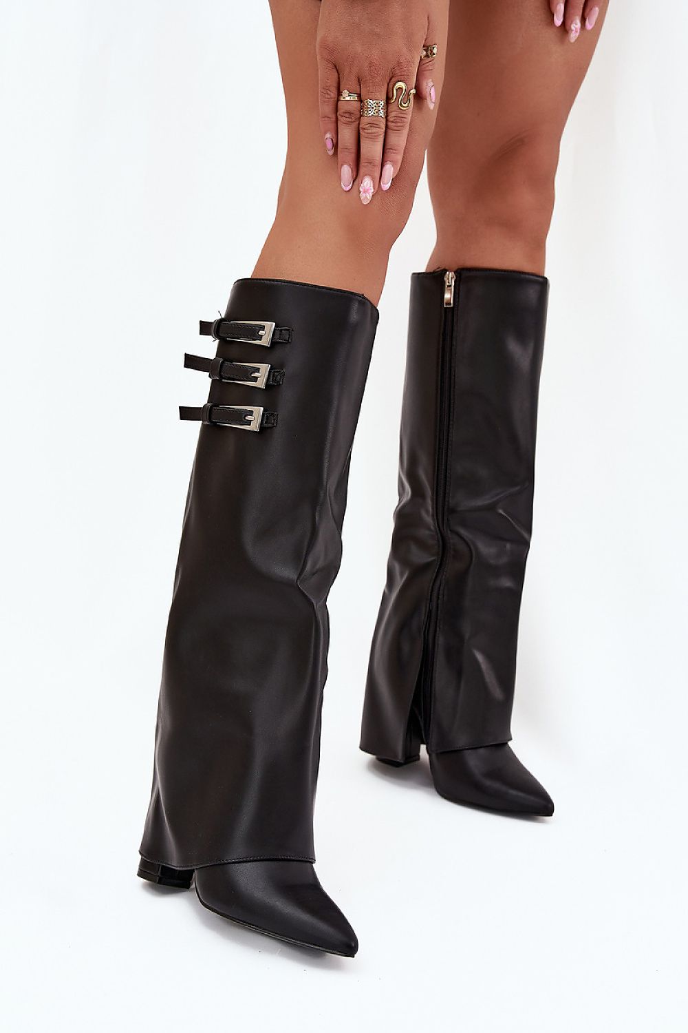 Close-up of women's eco leather heel boots showcasing intricate silver buckles and luxurious design elements, crafted by Step in Style.