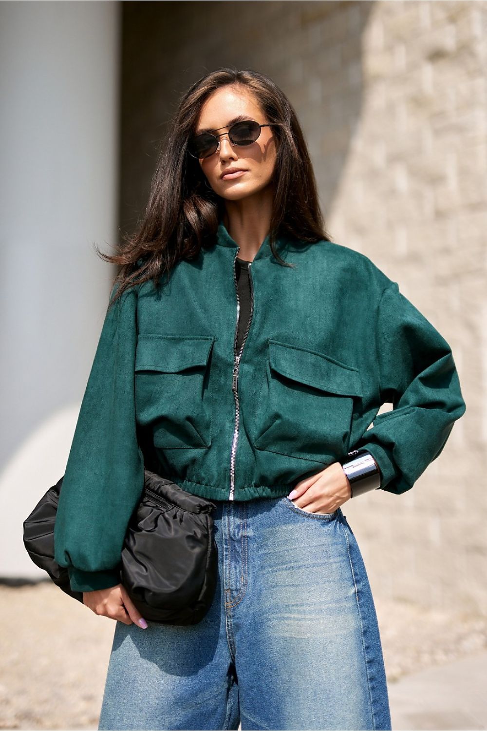 Side view of the luxurious Roco Fashion bomber jacket highlighting its loose oversized cut, ideal for both everyday and elegant outfits.