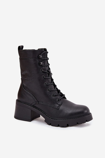 Close-up of Vinceza ankle boots showcasing intricate leaf detailing and plush interior lining for maximum comfort and elegance.