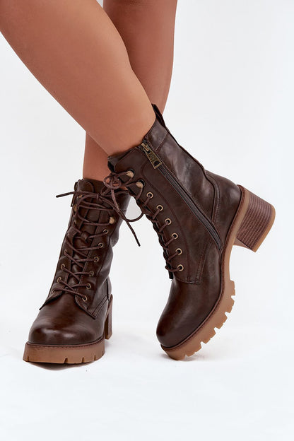 Vinceza Women's elegant ankle boots featuring comfort block heel and delicate leaf embossing, showcased in an upscale setting by Step in Style.