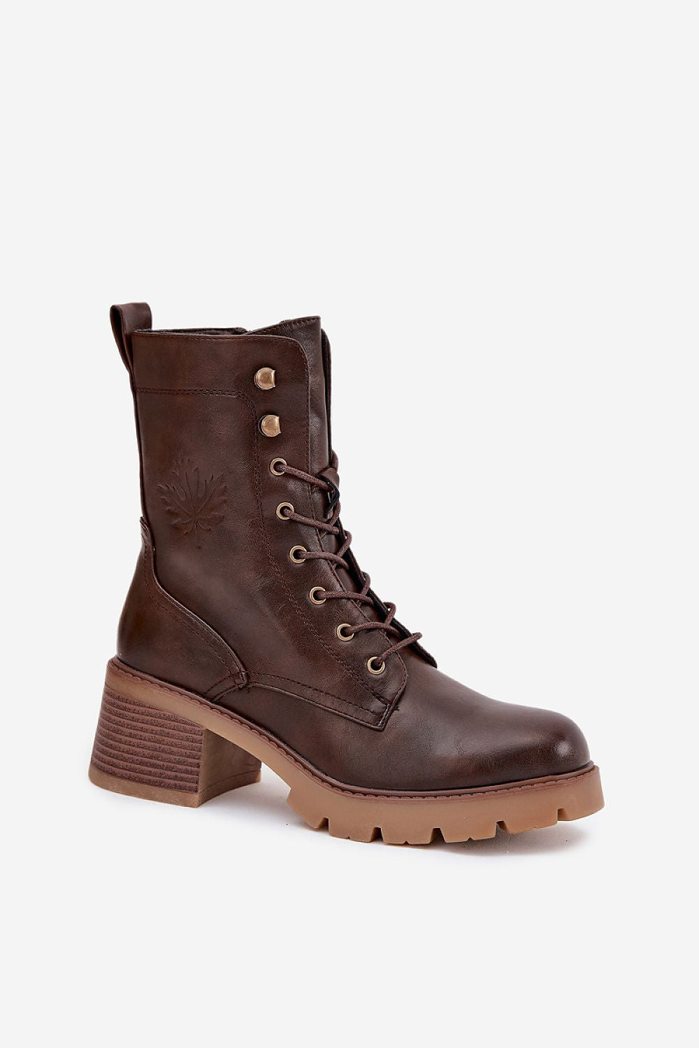 Close-up view of Vinceza Women's ankle boots with intricate leaf embossing and sturdy block heel, highlighting luxurious design by Step in Style.