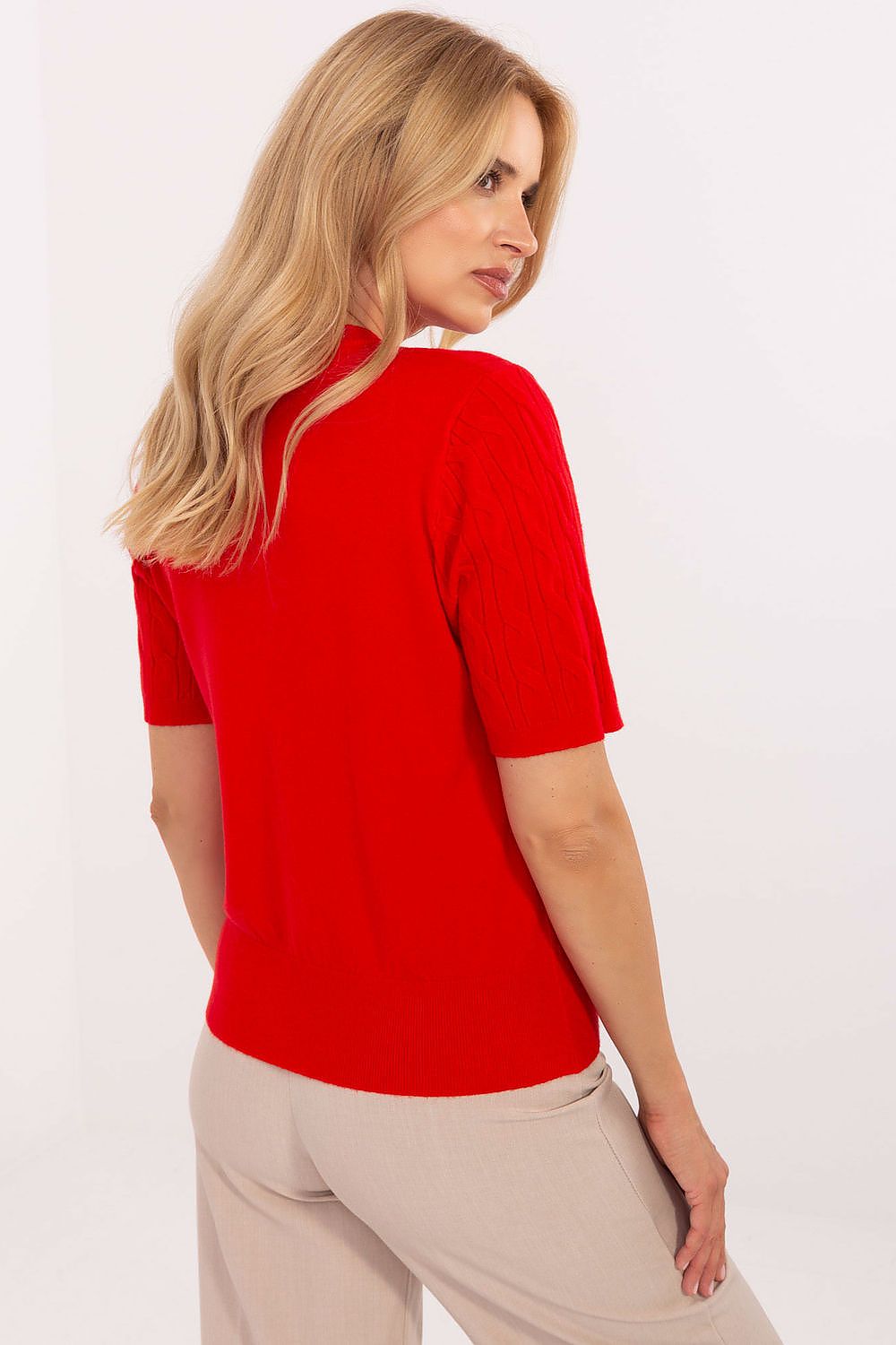 Model wearing the Factory Price elegant casual women's short sleeve sweater in L/XL size, showcasing its flattering silhouette and classic round neckline.