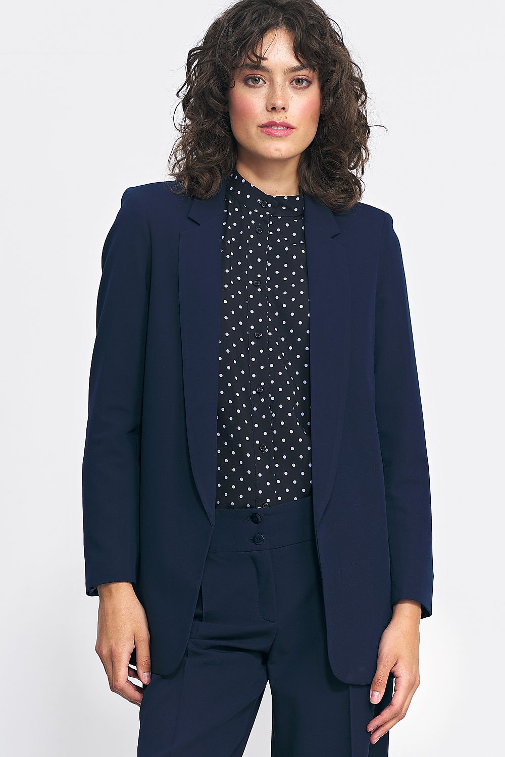 Elegant unfastened blazer jacket by Nife made from premium polyester, spandex, and viscose, showcases a classic silhouette perfect for modern women's office and casual styles.