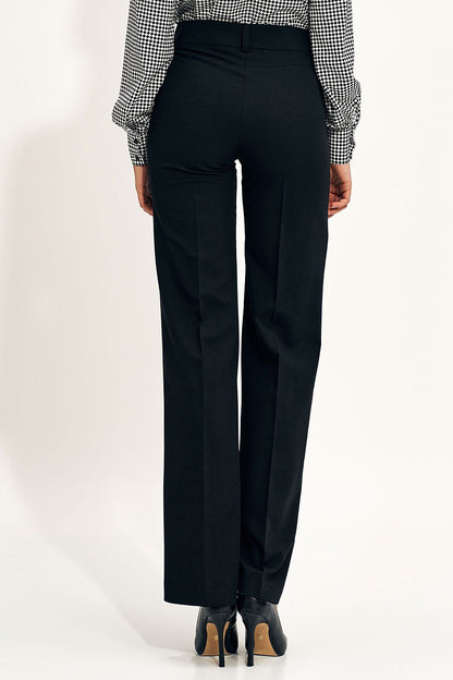Model wearing Nife wide leg trousers with high waist, epitomising elegance and sophistication in fashion.