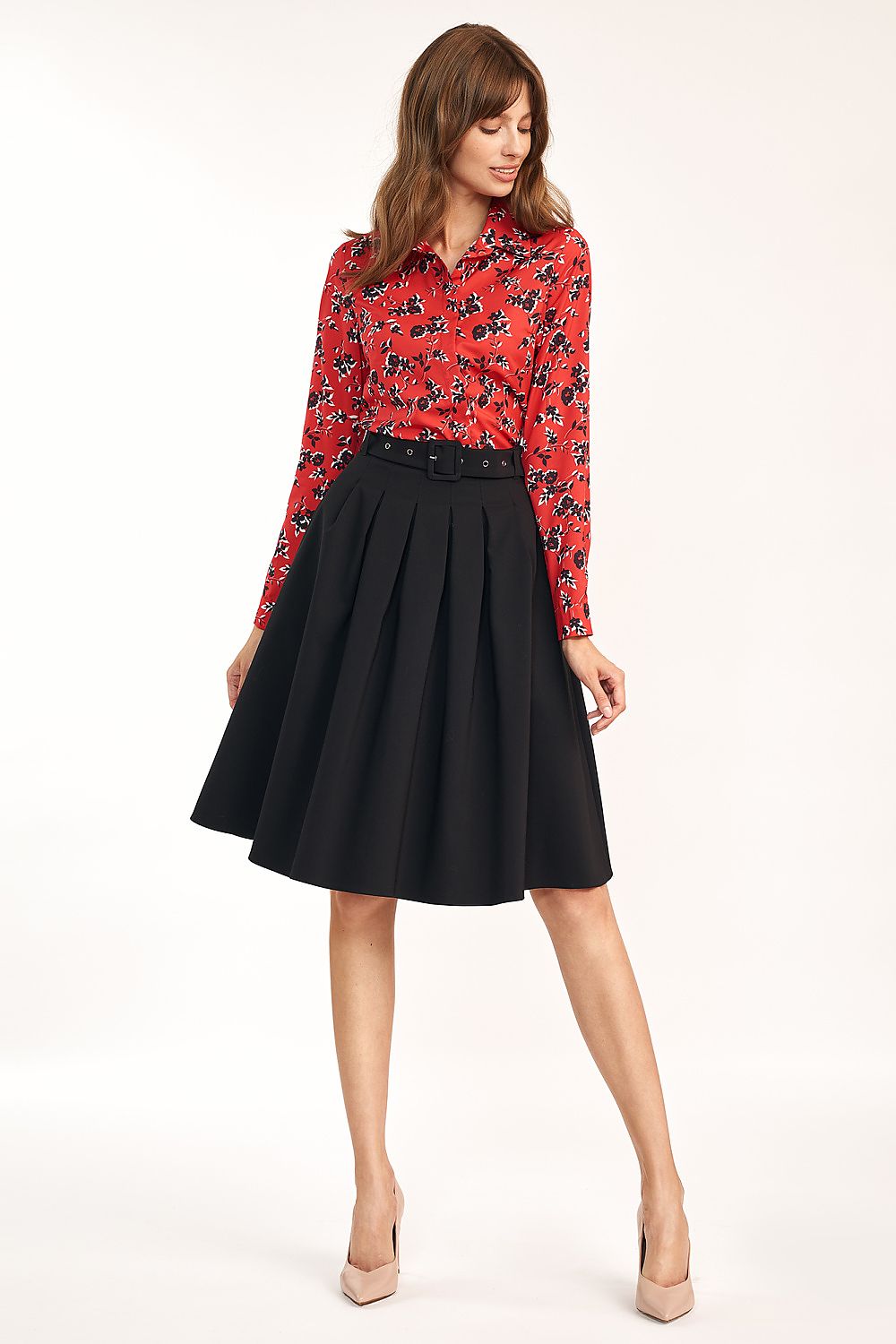 Elegant A-Line Skirt by Nife showcasing a refined office wear style, highlighting its conservative length and flattering silhouette.