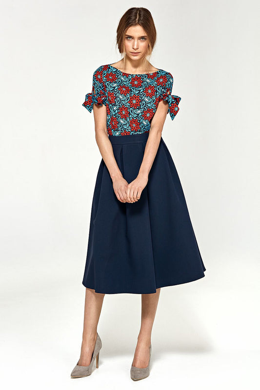 Chic Nife midi skirt with defined waistline and stylish pleats, perfect for elevating any wardrobe occasion.