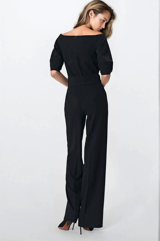 Luxurious black women's jumpsuit by Nife featuring a stylish cold-shoulder cut and chic wide belt, available in sizes EU 34-42, perfect for elegant office styling.