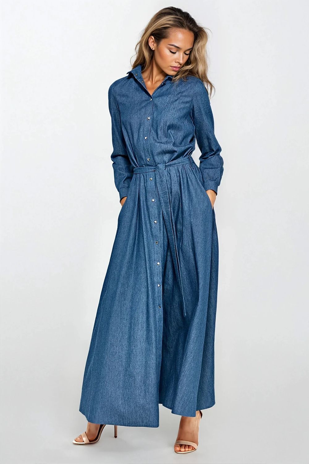 Luxury denim maxi dress by Nife featuring long sleeves, a belted waist, and chic shirt-like detail. Perfect for sophisticated style.