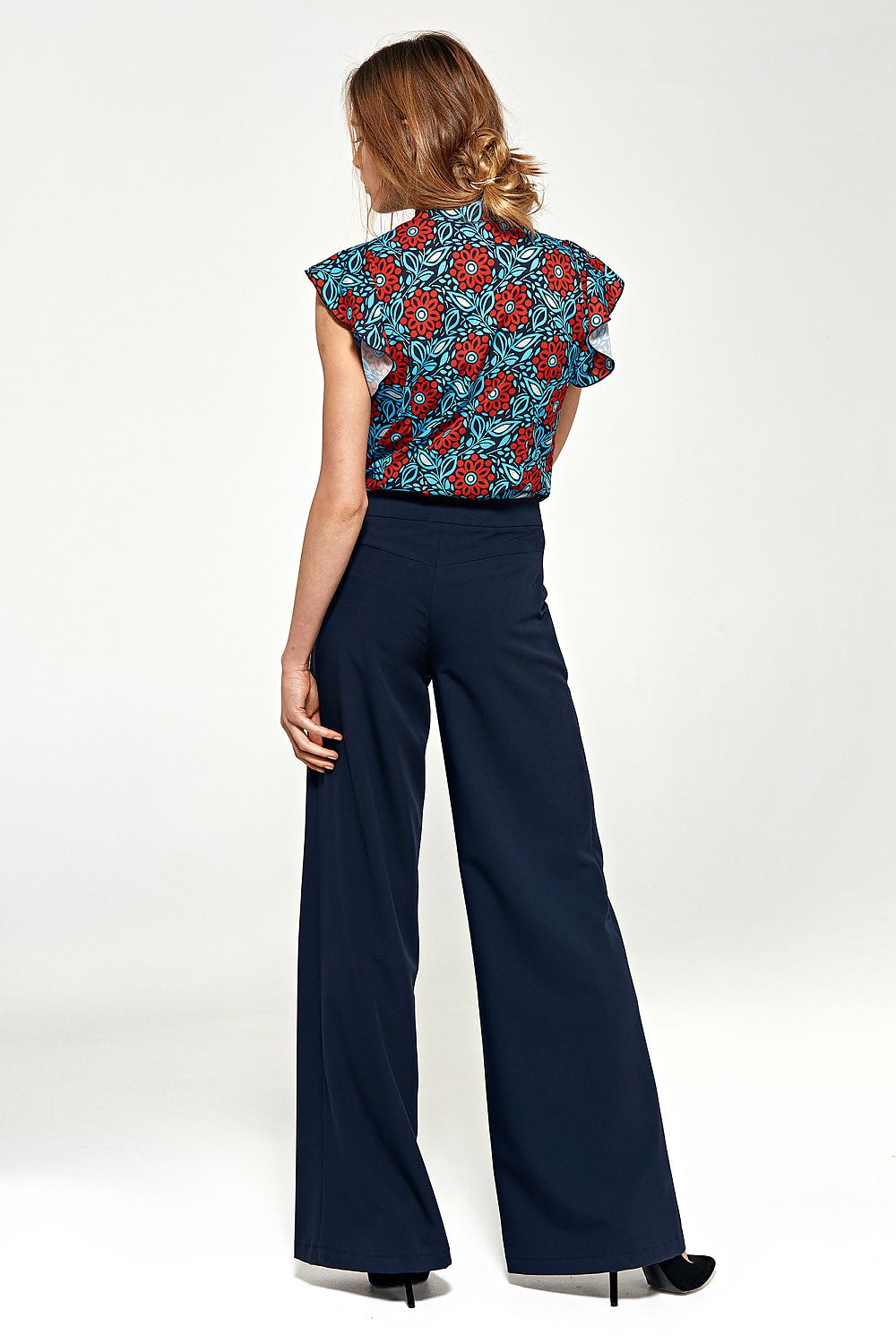 Nife luxury navy blue palazzo pants with flared legs showcasing practical pockets, ideal for trendy and sophisticated outfits.