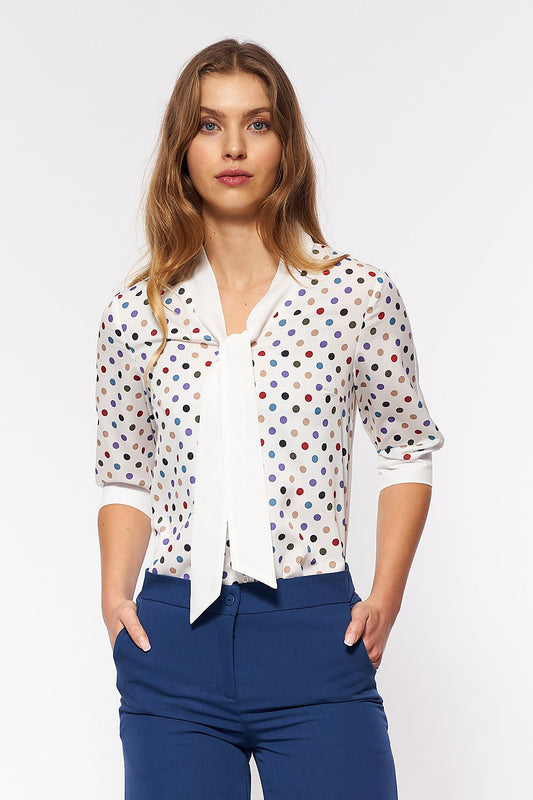 Nife Long Sleeve Blouse featuring colourful polka dots, designed to evoke a luxurious 60s inspired aesthetic, perfect for a chic office outfit.