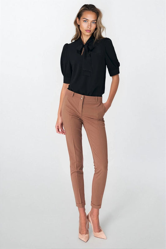 Close-up of Nife blouse detail featuring a stylish neck tie and elegant puffy sleeves, crafted for comfort and sophistication.