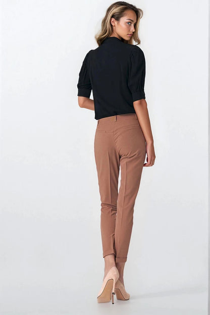 Close-up of the Nife blouse showcasing its luxurious fabric and exquisite puffy sleeve design, perfect for refined casual attire.