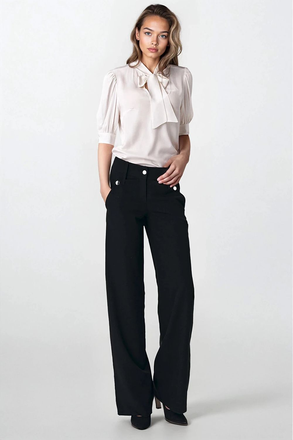 Fashionable Nife blouse in elegant presentation, highlighting the unique cut and sophisticated details, suitable for any stylish occasion.