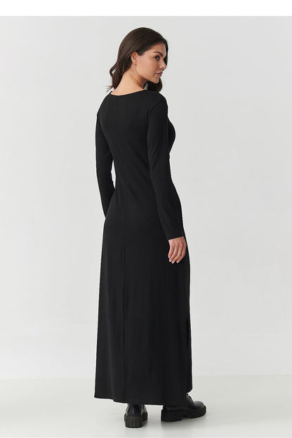 Stylish Makadamia maxi dress with long sleeves and subtle side slits, perfect for versatile daily wear and chic outings.