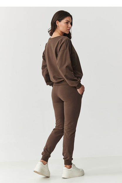 Luxurious Makadamia cotton blend tracksuit with embroidered logo, combining modern elegance and chic comfort for versatile wear.