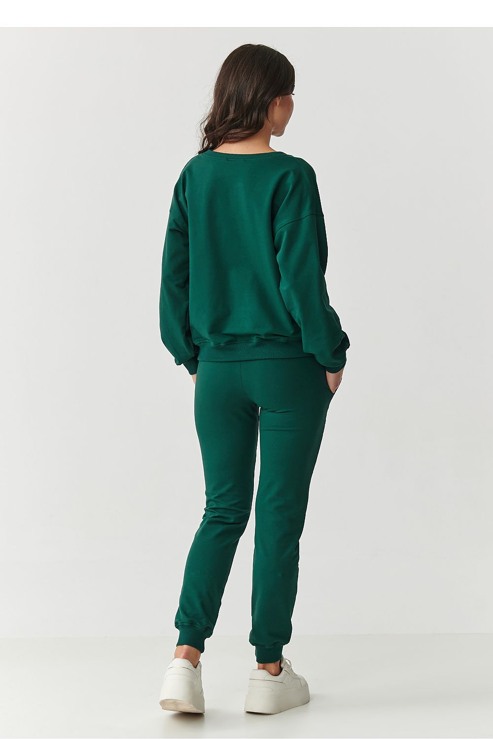 Fashionable Makadamia relaxed fit tracksuit set showcasing minimalist design, ideal for both casual home wear and stylish outings.