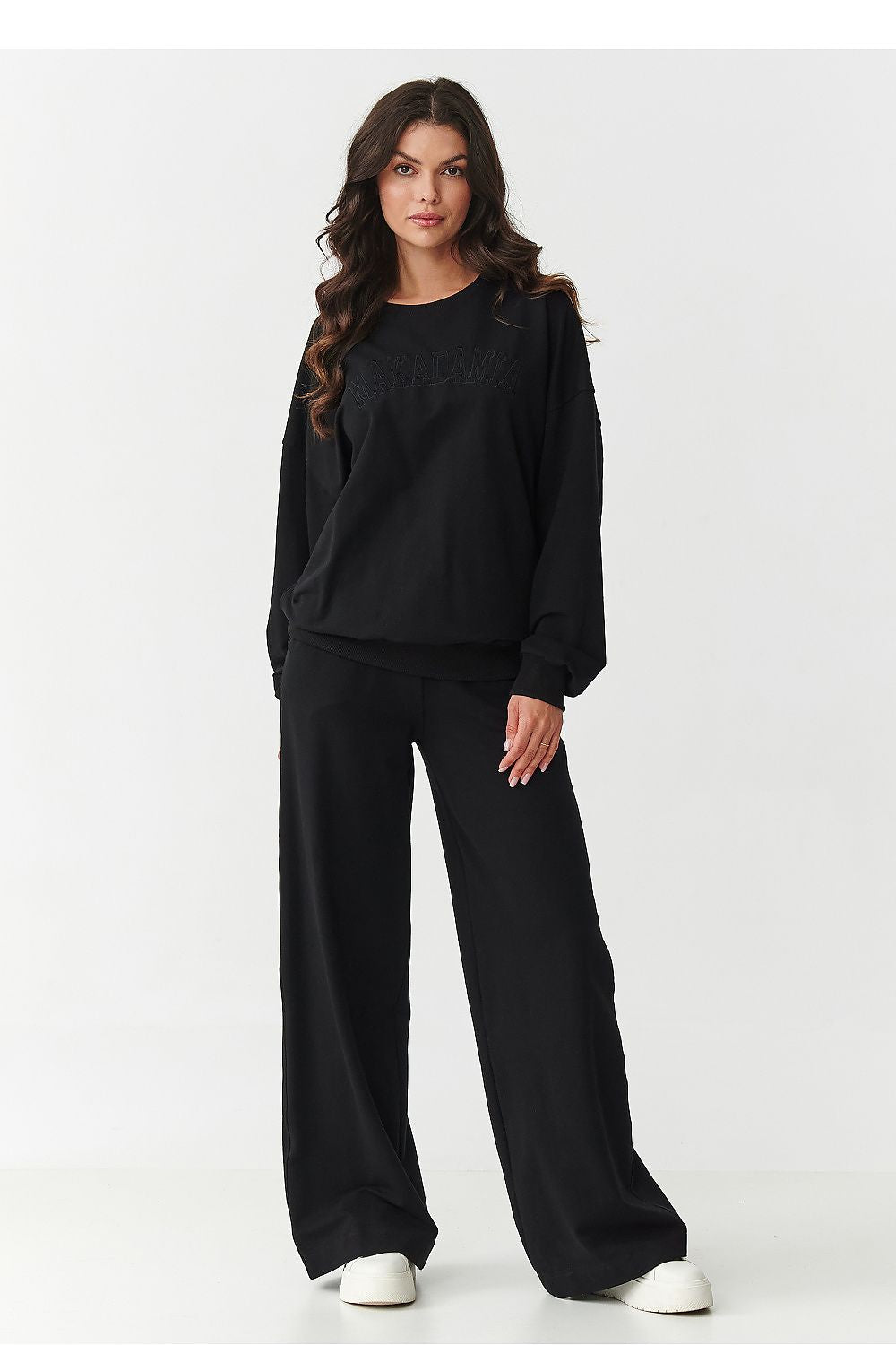 Elegant display of Makadamia women's tracksuit set laid flat, showcasing the quality cotton and elastane fabric, perfect for a fashionable and comfortable wardrobe.