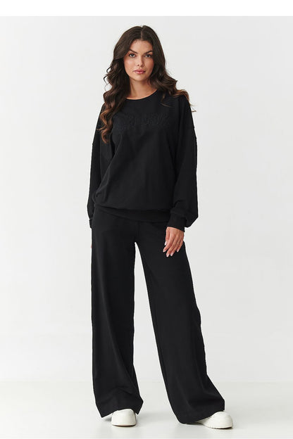 Elegant display of Makadamia women's tracksuit set laid flat, showcasing the quality cotton and elastane fabric, perfect for a fashionable and comfortable wardrobe.