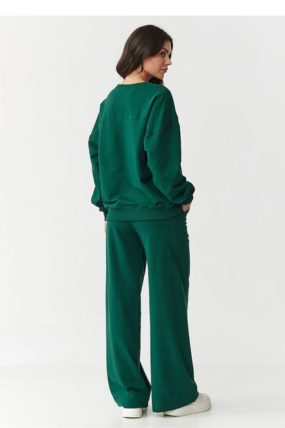 Chic snapshot of Makadamia women's tracksuit set showcasing the oversized sweatshirt and trendy wide-legged pants, ideal for a fashionable, relaxed look.
