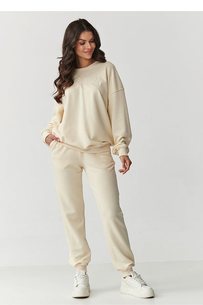 Luxury women's cotton tracksuit set by Makadamia featuring an embroidered logo, showcasing a stylish and comfortable design perfect for everyday wear.