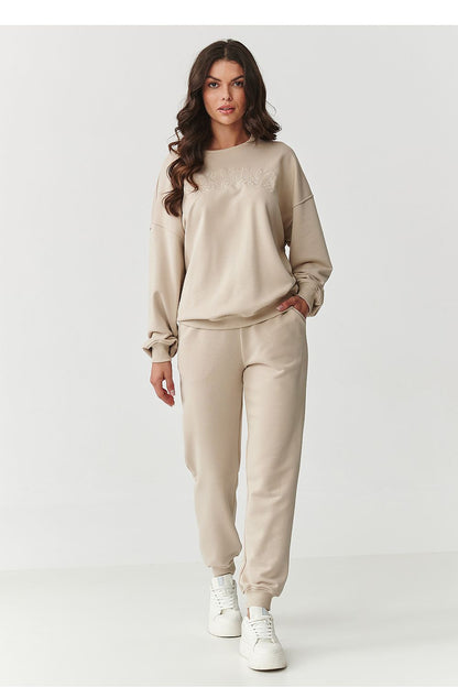 Close-up of Makadamia's luxury tracksuit sweatshirt showcasing the high-quality cotton fabric and elegant design.