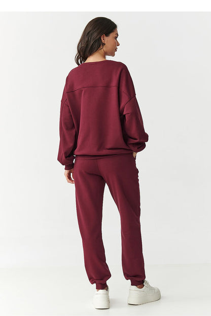 Stylish Makadamia tracksuit pants featuring elastic waistband and ribbed cuffs, made from high-quality cotton for ultimate comfort and luxury.