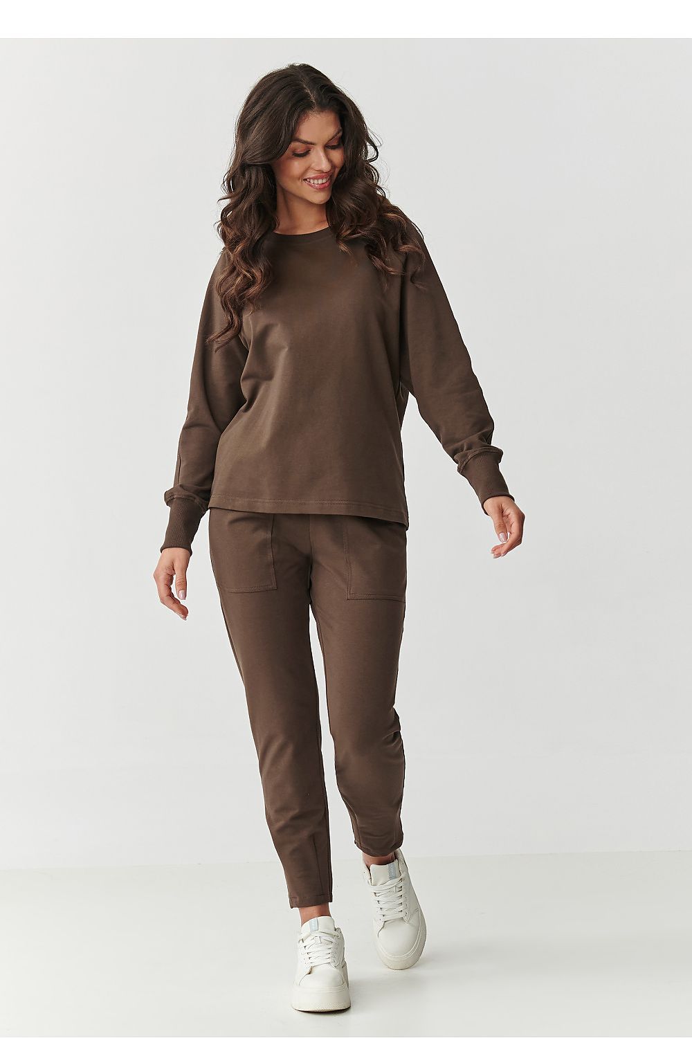 Close-up of the Makadamia women's tracksuit set showcasing the soft cotton blend material and sporty ribbed detailing, designed for fashionable comfort.