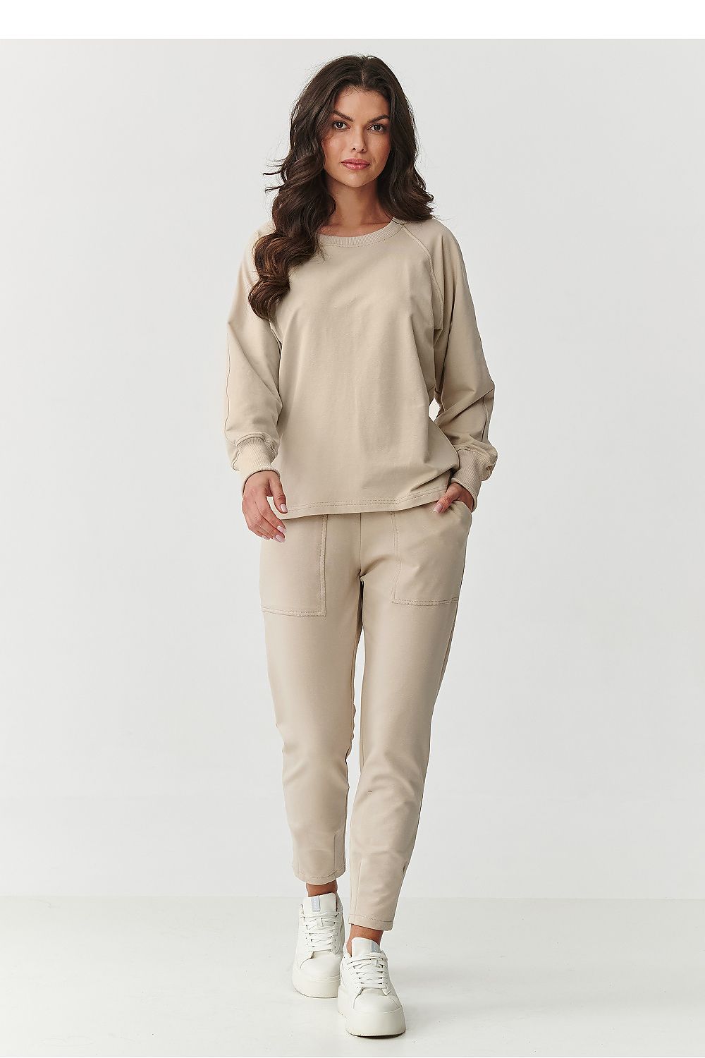 Fashion-forward Makadamia tracksuit displayed in elegant styling, designed for durability and shape retention.