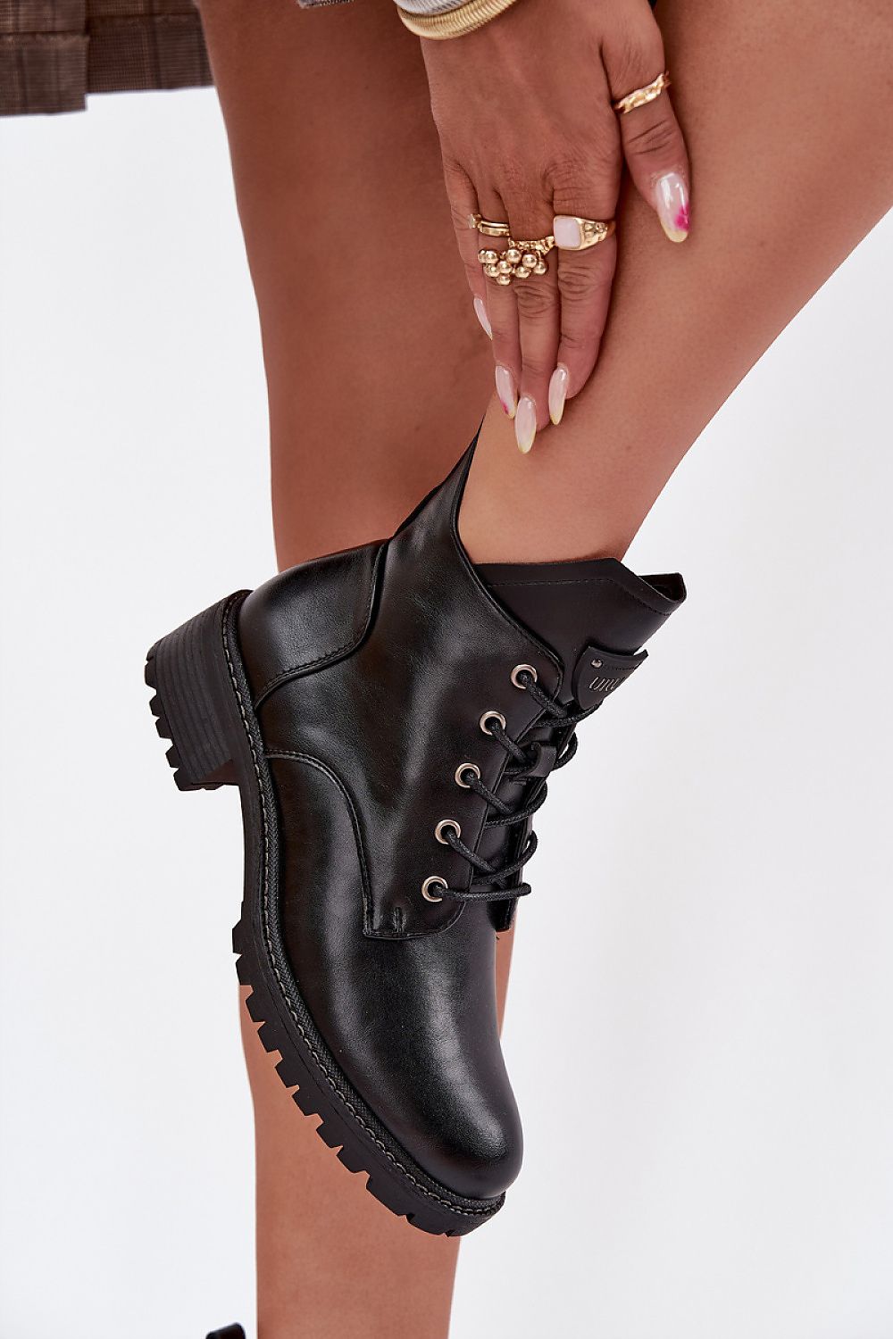 Close-up of Vinceza women's ankle boots highlighting the soft artificial leather material and delicate block heel for a modern touch.