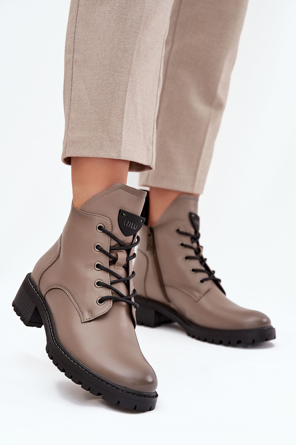 Vinceza women's ankle boots in a chic setting, emphasizing the warm, insulated interior and stylish accents for seasonal wear.