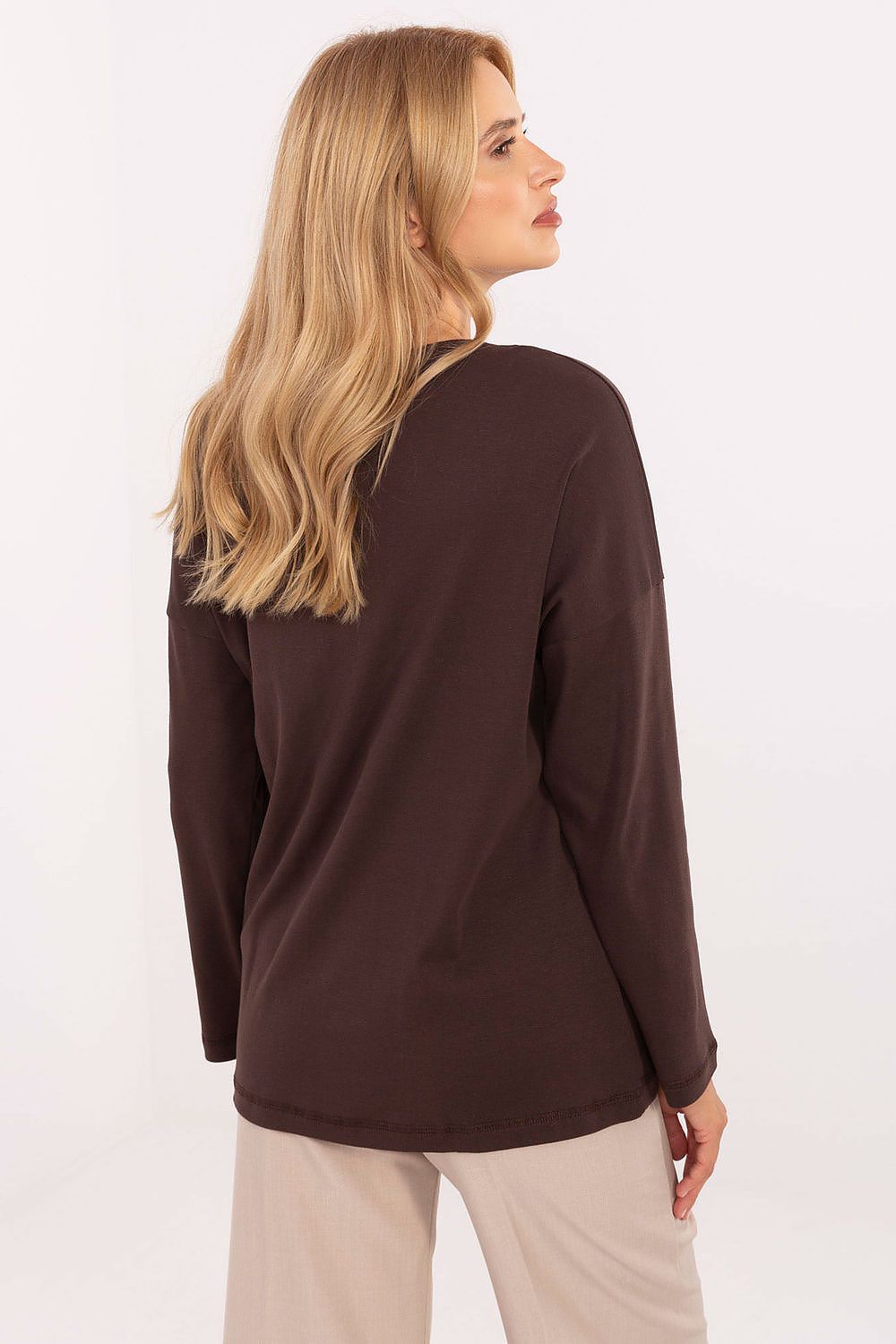 Close-up of the premium fabric blend cotton and spandex in a women's blouse by Relevance, showing luxurious comfort.