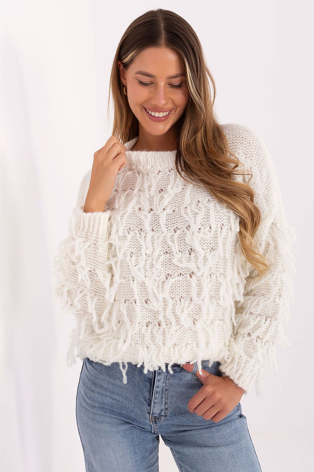 Luxurious plain backdrop emphasizes the soft texture and sophisticated design of Luxe Rue Paris Jumper, perfect for elegant looks.