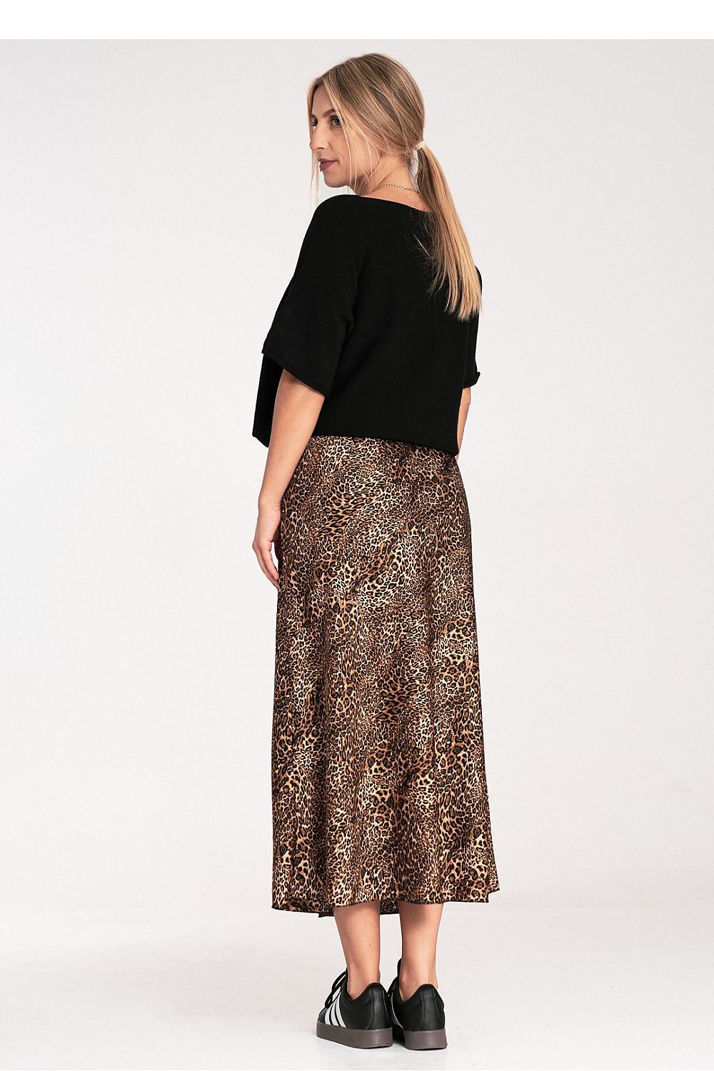 Model wearing the Figl Bat Style Blouse in a chic setting, highlighting its elegant silhouette and versatile fashion appeal.